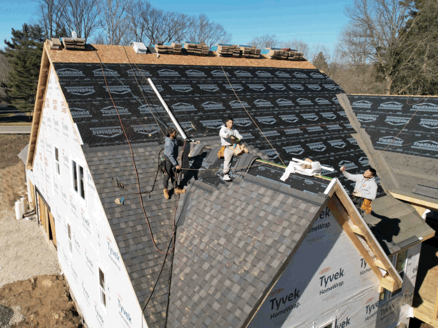 Aerial drone photo of workers replacing a commercial roof in Northeast Ohio — shot by FAA Part 107 licensed pilot Ed Rich of NE Ohio Drone